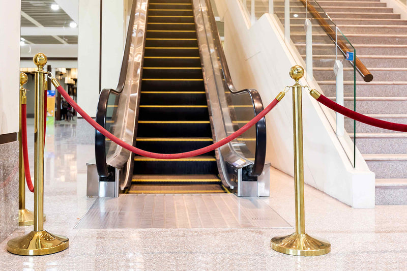 Facility Signs for property management, featuring crowd control stanchions