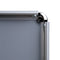 Corner of open poster frame with rounded corner.