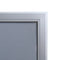 Corner detail of poster frame with swing door