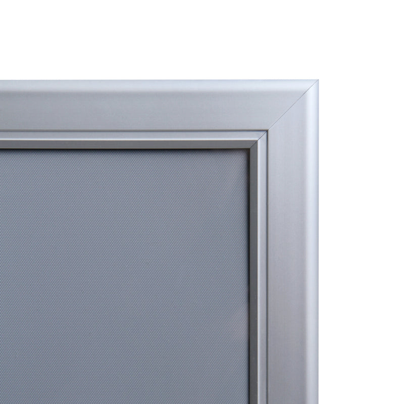 Corner detail of poster frame with swing door