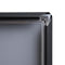 Corner view of black poster frame for wall with snap frame opened